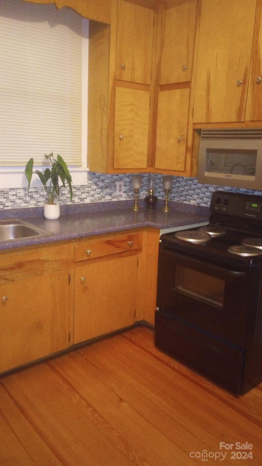 143 Lancaster Street Chester, SC 29706 - Photo 15 of 29 a bathroom with a sink and a mirror
