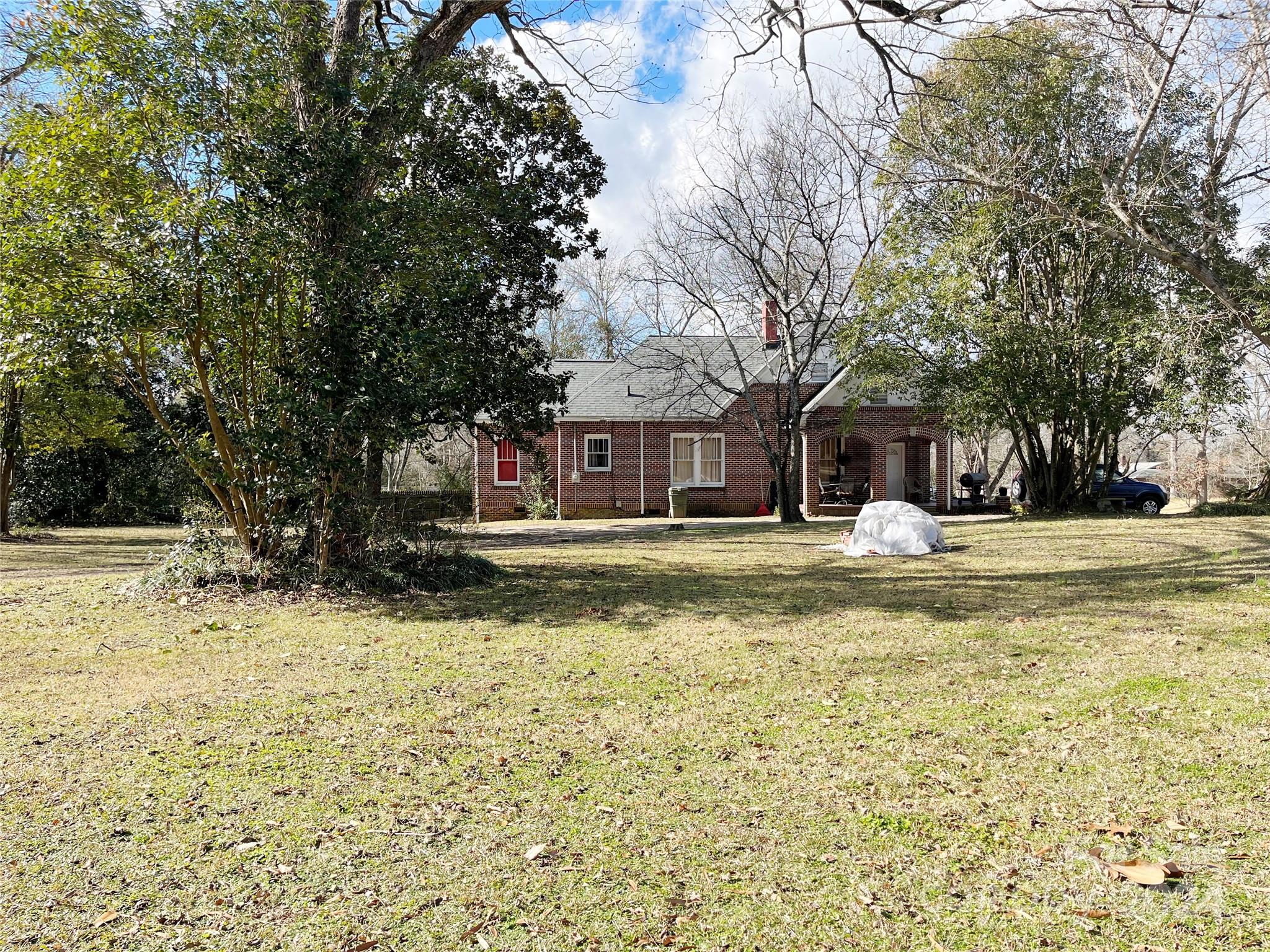 143 Lancaster Street Chester, SC 29706 - Photo 3 of 29 a view of the house with a yard