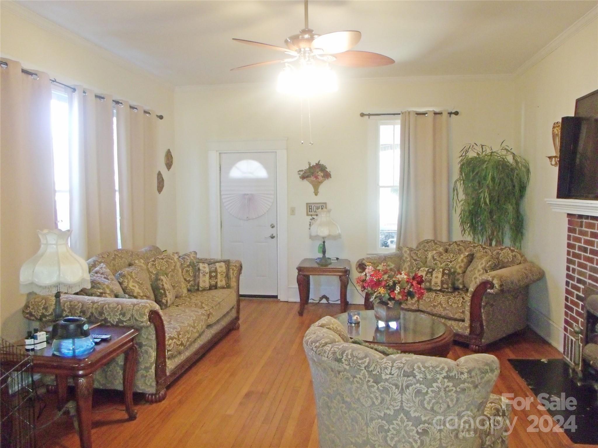 143 Lancaster Street Chester, SC 29706 - Photo 6 of 29 a living room with furniture and a large mirror