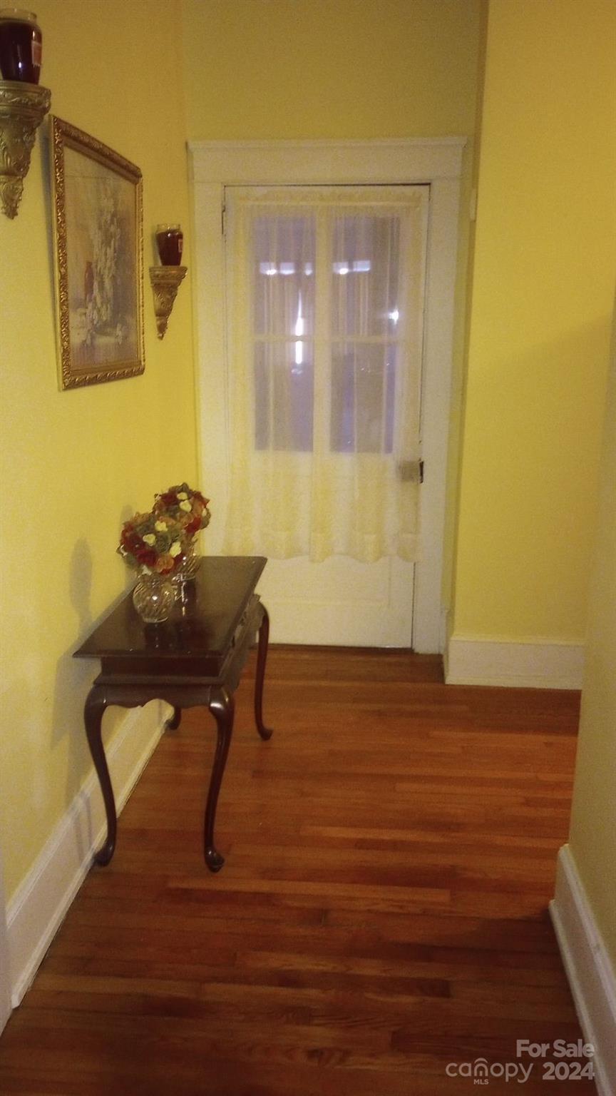 143 Lancaster Street Chester, SC 29706 - Photo 7 of 29 a room with wooden floor and furniture