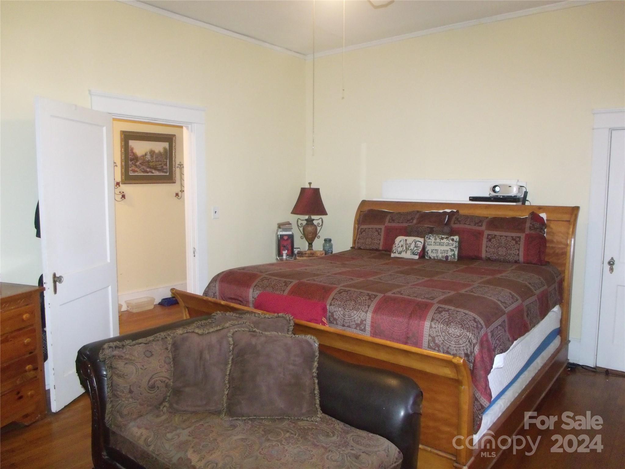 143 Lancaster Street Chester, SC 29706 - Photo 10 of 29 a bedroom with a bed and wooden floor