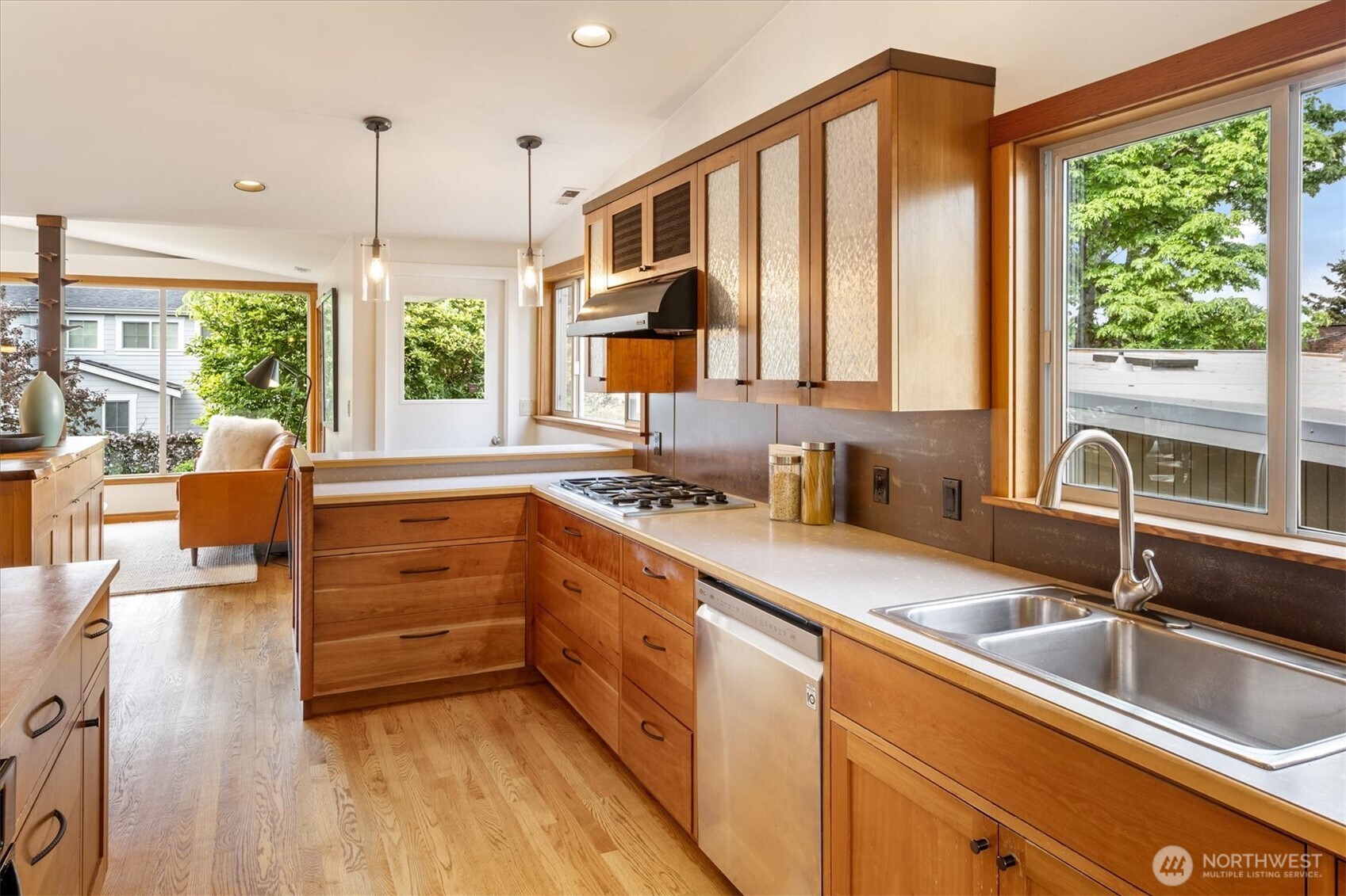 6420 Northeast 60th Street Seattle, WA 98115 - Photo 13 of 40 a kitchen with a sink window and cabinets