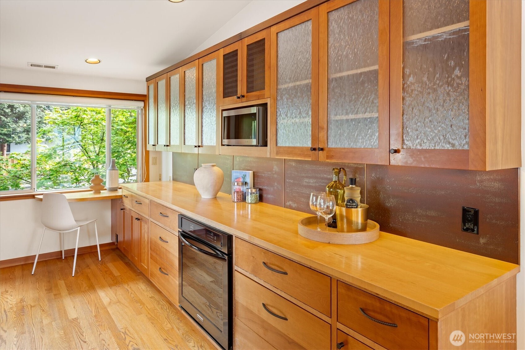 6420 Northeast 60th Street Seattle, WA 98115 - Photo 14 of 40 a kitchen with sink cabinets and wooden floor