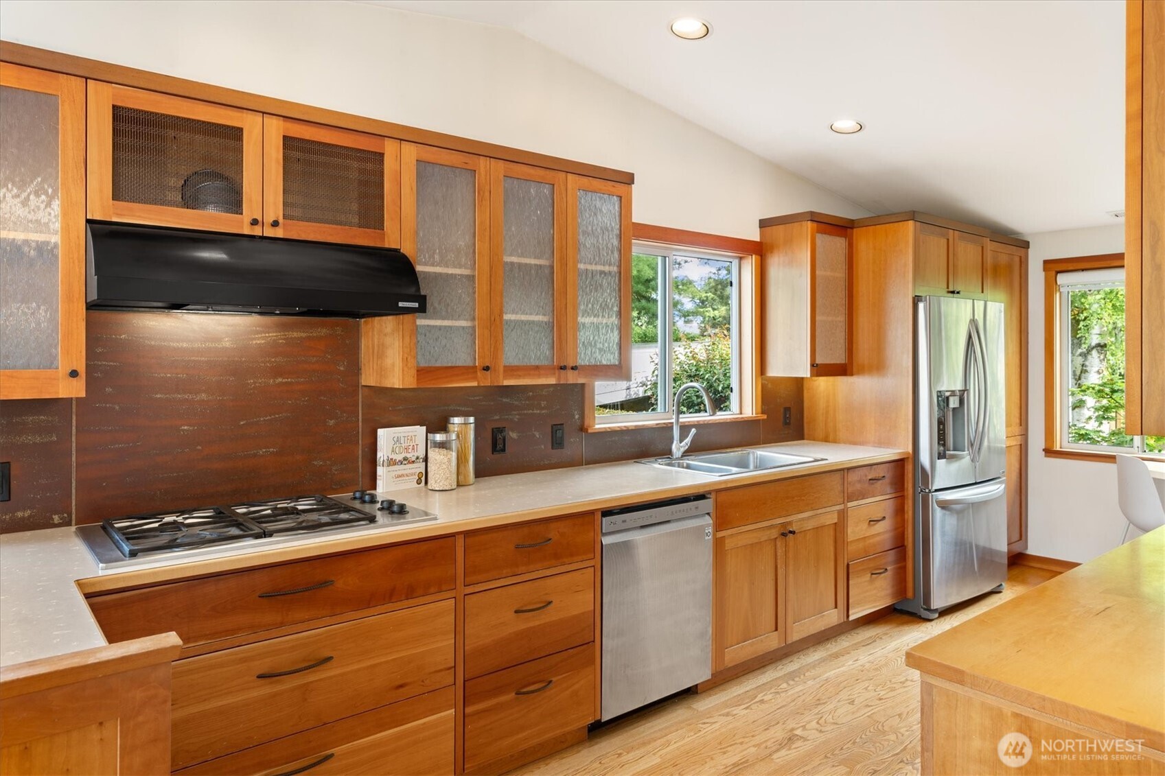 6420 Northeast 60th Street Seattle, WA 98115 - Photo 15 of 40 a kitchen with a sink stove and cabinets
