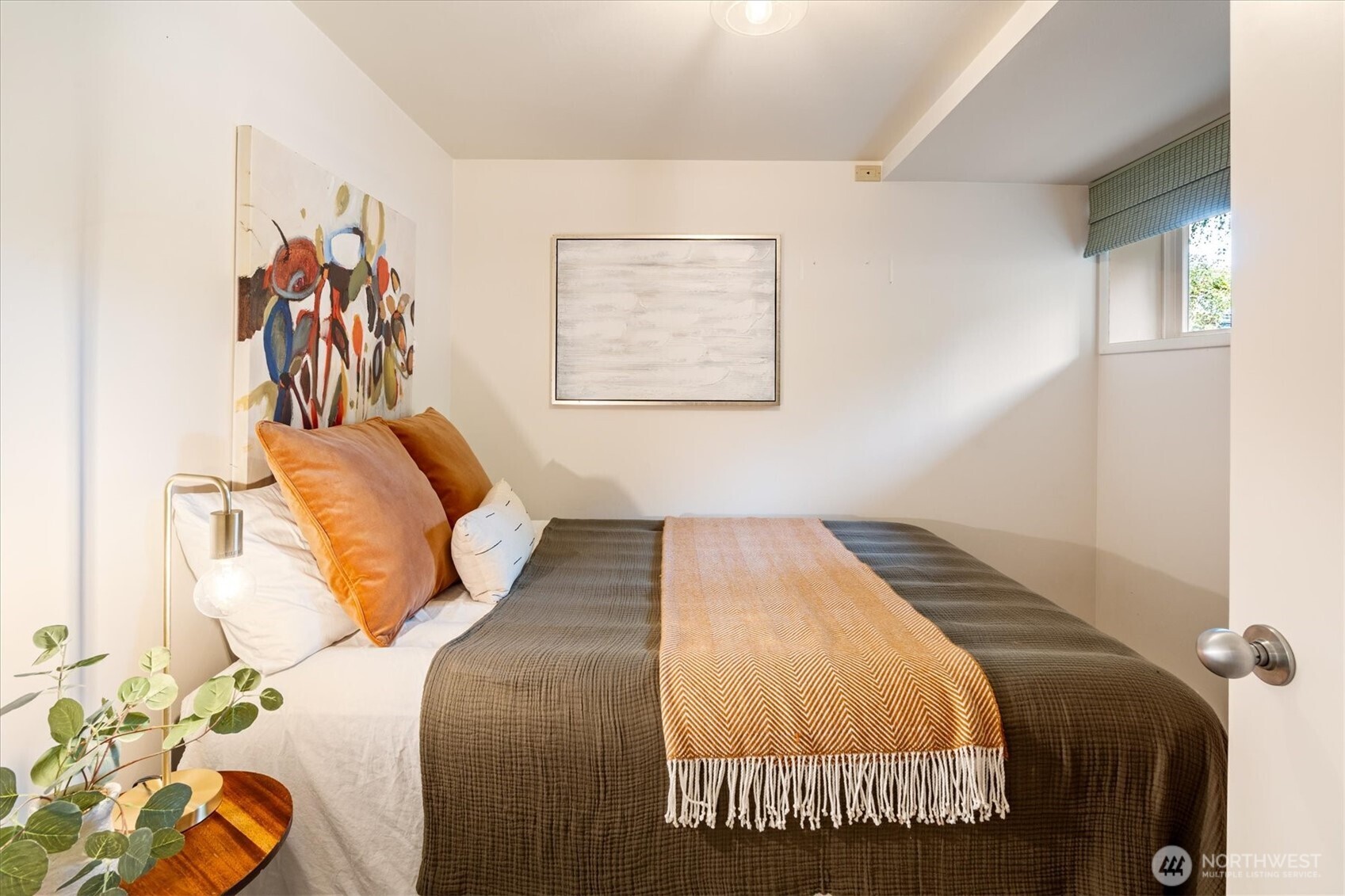 6420 Northeast 60th Street Seattle, WA 98115 - Photo 27 of 40 a bedroom with a bed and a painting on the wall