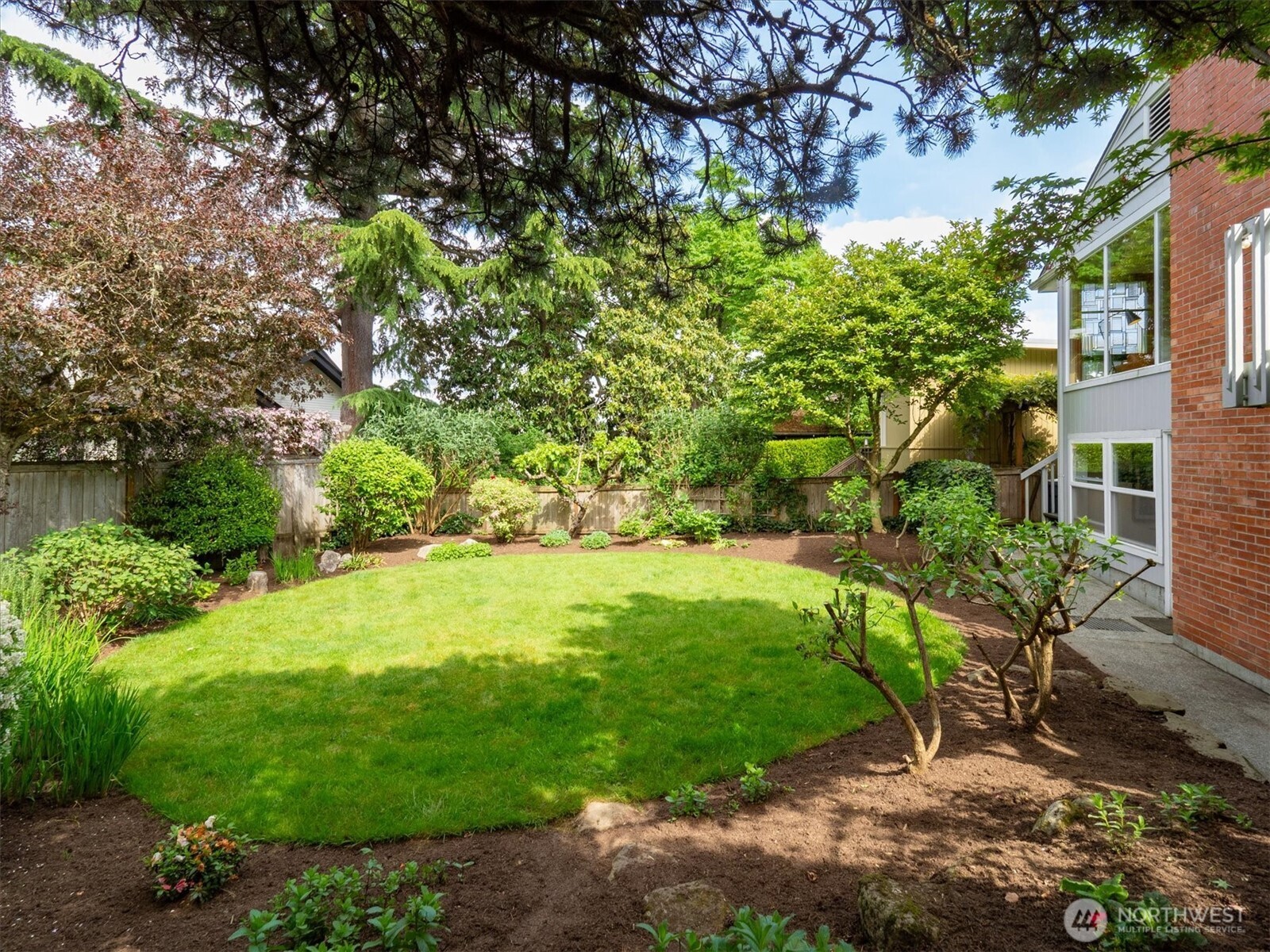 6420 Northeast 60th Street Seattle, WA 98115 - Photo 34 of 40 a view of a garden with an outdoor space