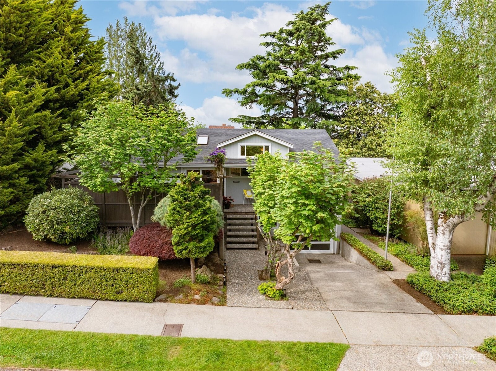 6420 Northeast 60th Street Seattle, WA 98115 - Photo 39 of 40 a front view of a house with a yard