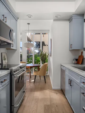 an aerial view of residential house with an outdoor space and seating