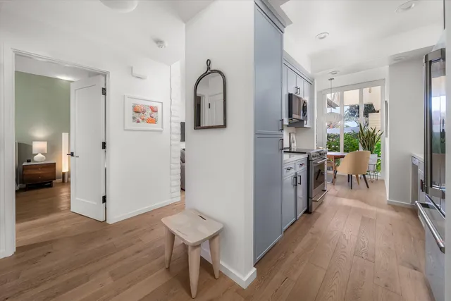 a view of a pathway of a house with a tree