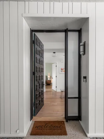 a living room with furniture or couch and a large window