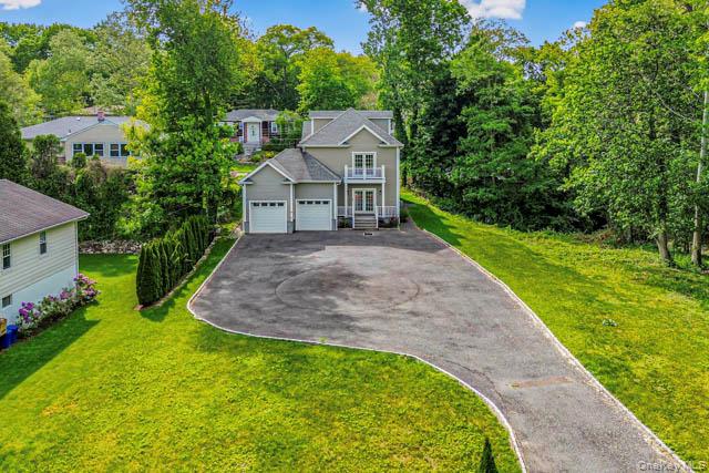 1 Kewanee Road New Rochelle, NY 10804 - Photo 33 of 36 a view of a house with a small yard plants and large tree