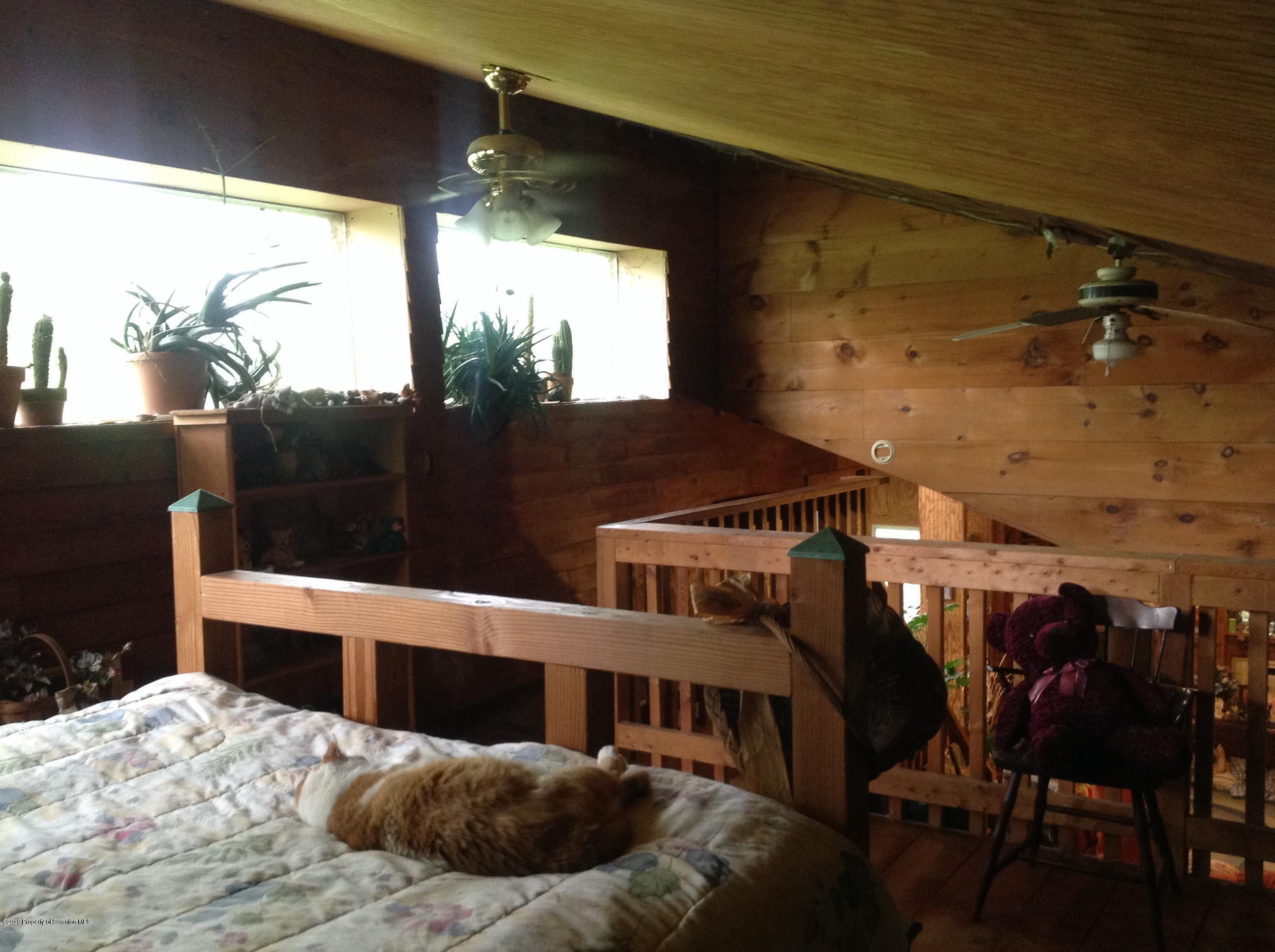 875 Marshall Squier Road Nicholson, PA 18446 - Photo 12 of 29 a bedroom with a bed and window