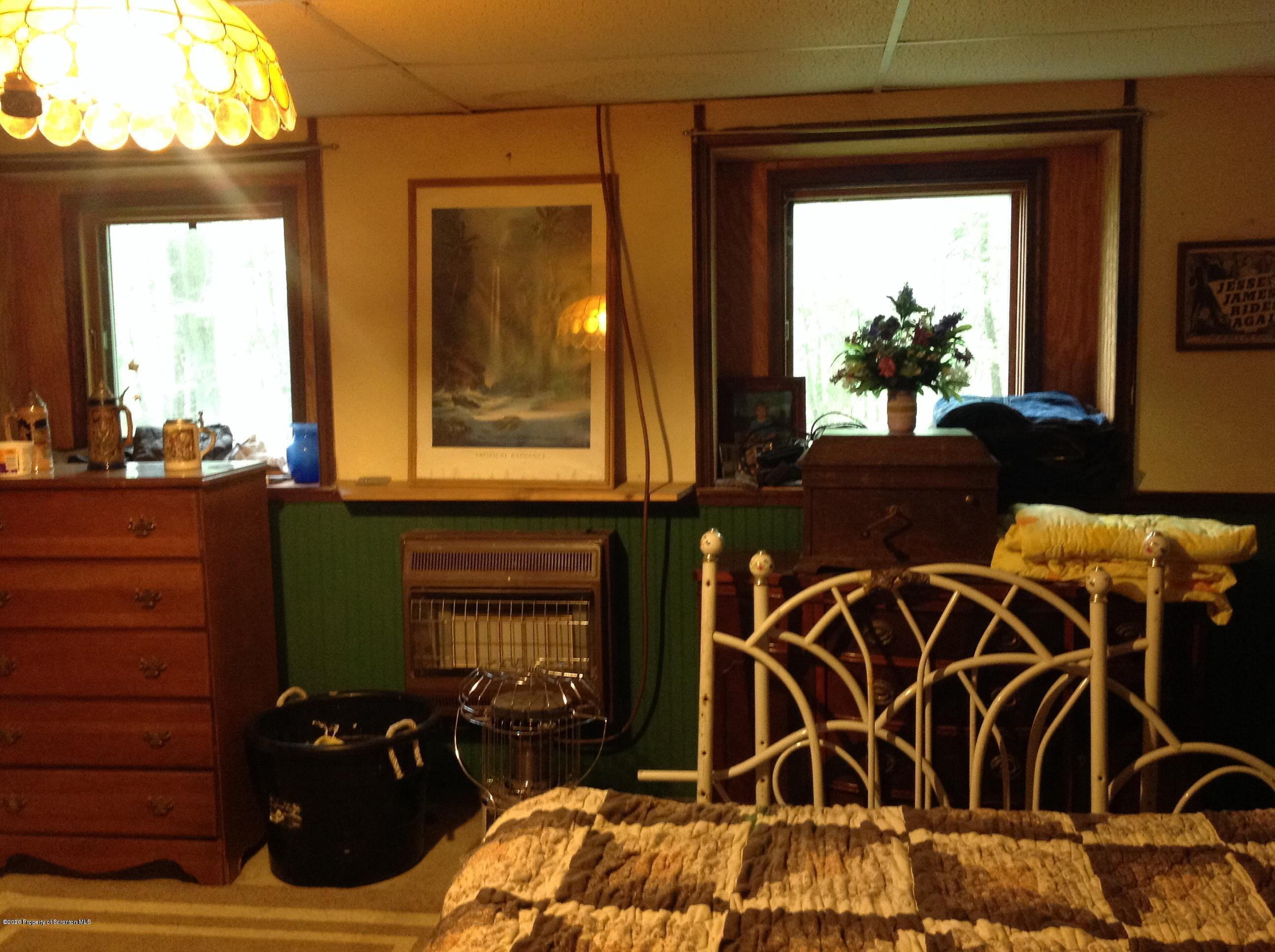 875 Marshall Squier Road Nicholson, PA 18446 - Photo 25 of 29 a living room with furniture and a window