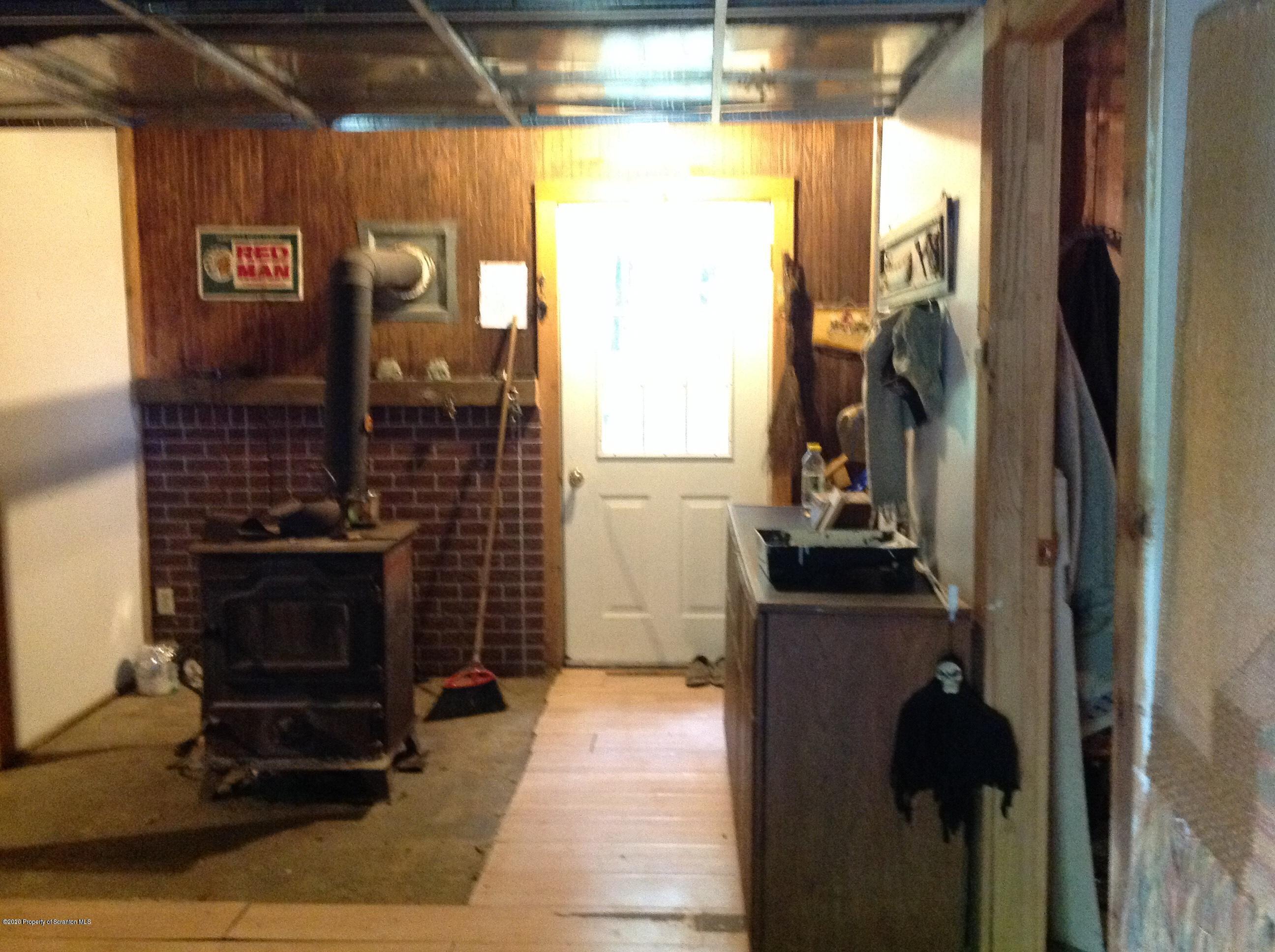 875 Marshall Squier Road Nicholson, PA 18446 - Photo 26 of 29 a kitchen with a sink and a refrigerator