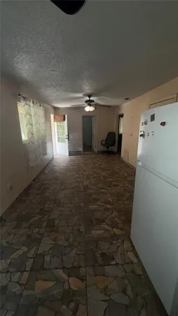 a kitchen with a sink and a refrigerator