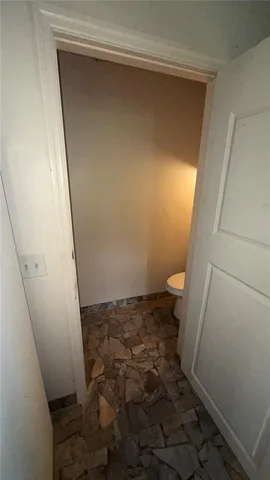 a view of a small house with a yard