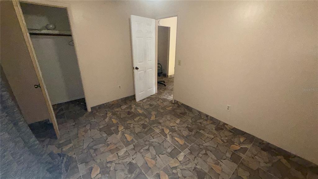 248 Fraser Road DeBary, FL 32713 - Photo 6 of 18 an empty room with a door