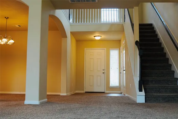 a view of a room with wooden door