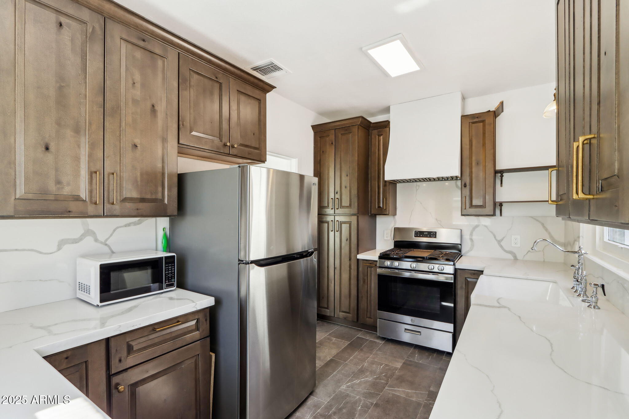 2237 North 9th Street Phoenix, AZ 85006 - Photo 10 of 29 a kitchen with a refrigerator sink and stove
