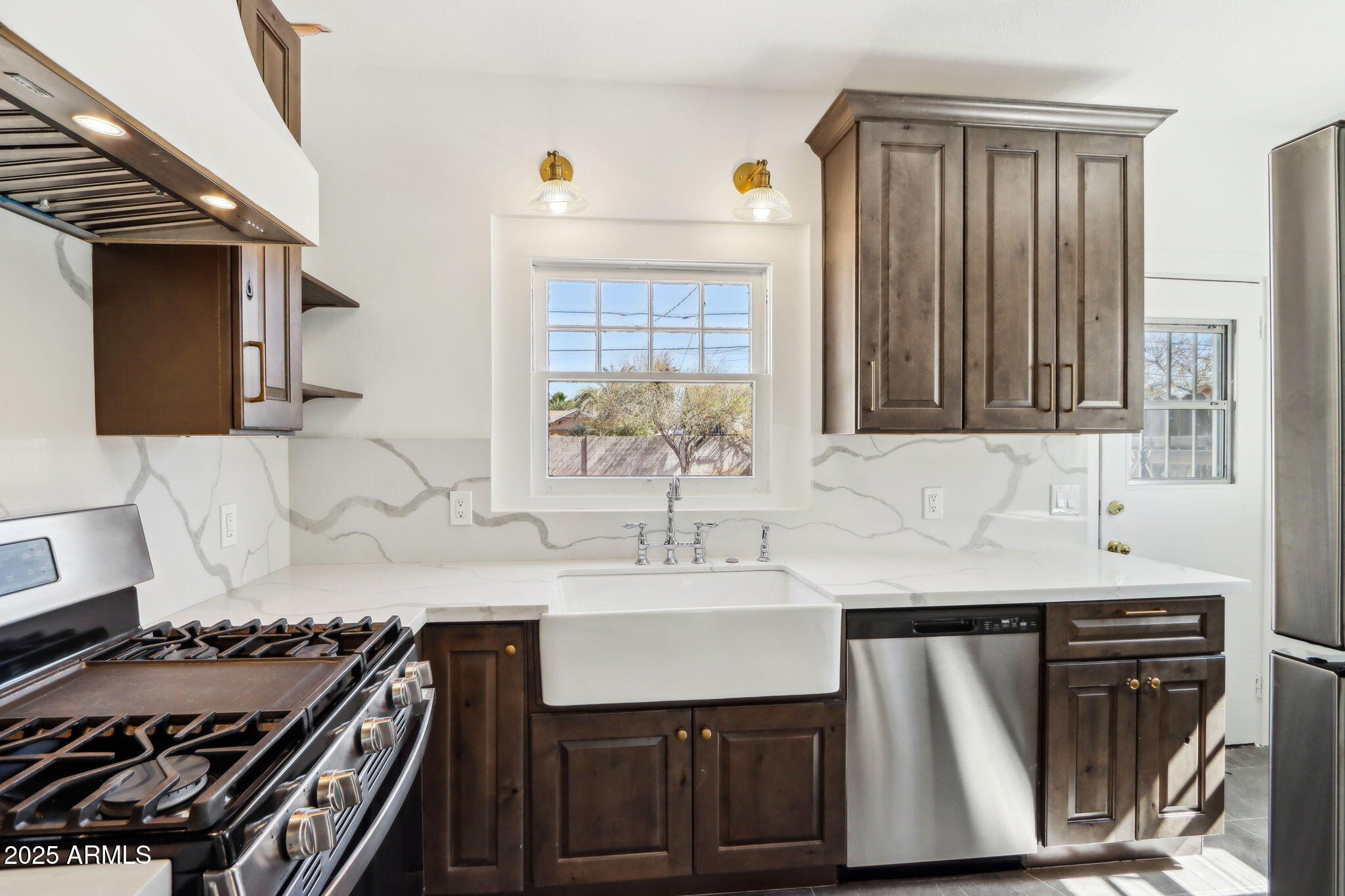 2237 North 9th Street Phoenix, AZ 85006 - Photo 14 of 29 a kitchen with a sink stove and cabinets
