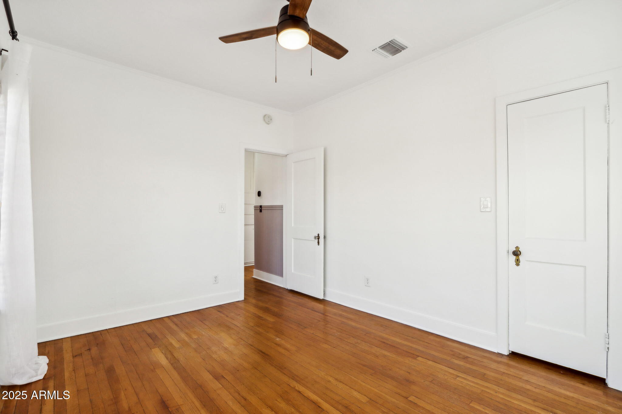 2237 North 9th Street Phoenix, AZ 85006 - Photo 17 of 29 a view of an empty room with wooden floor