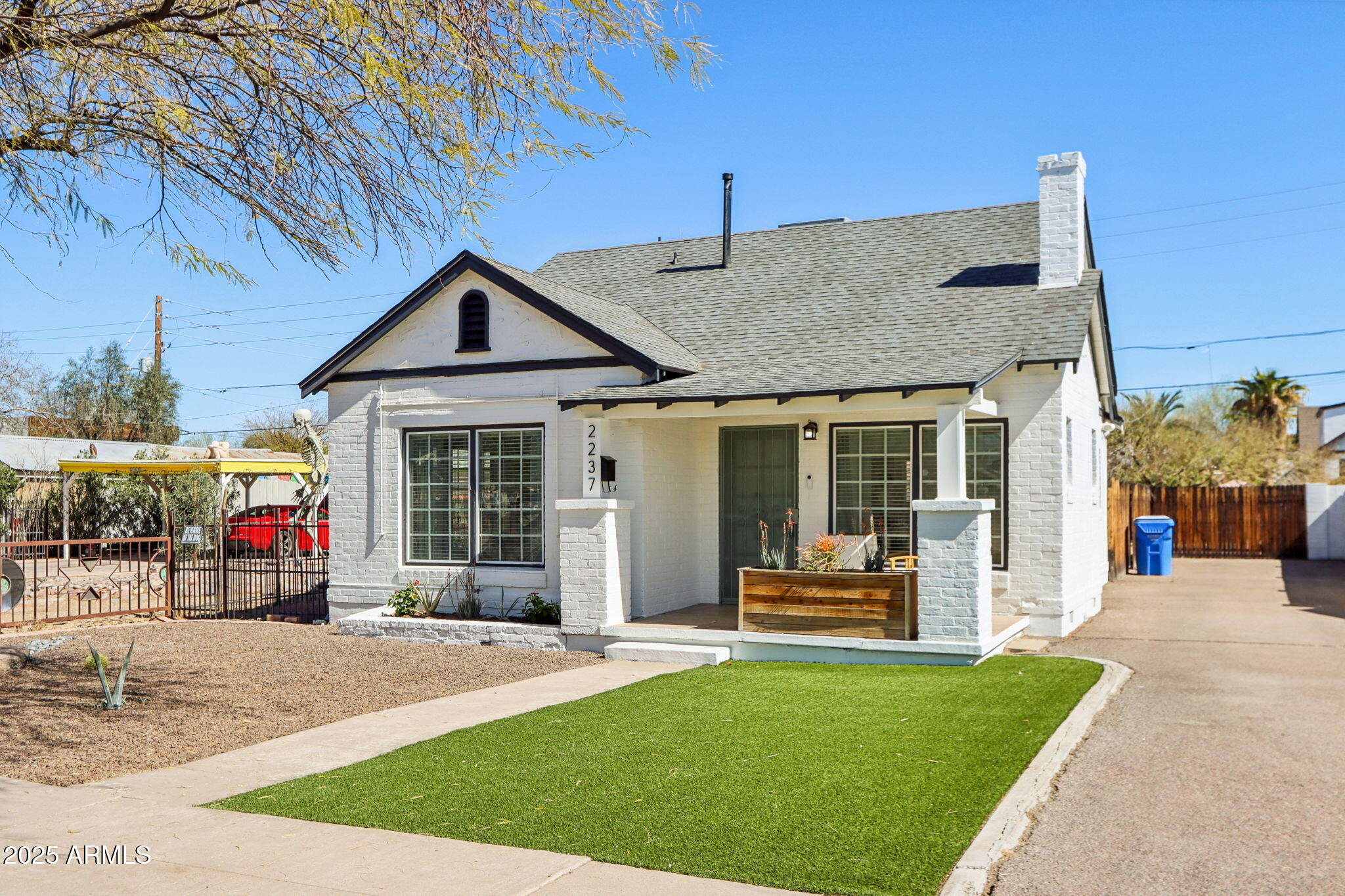 2237 North 9th Street Phoenix, AZ 85006 - Photo 27 of 29 a front view of a house with a garden and patio