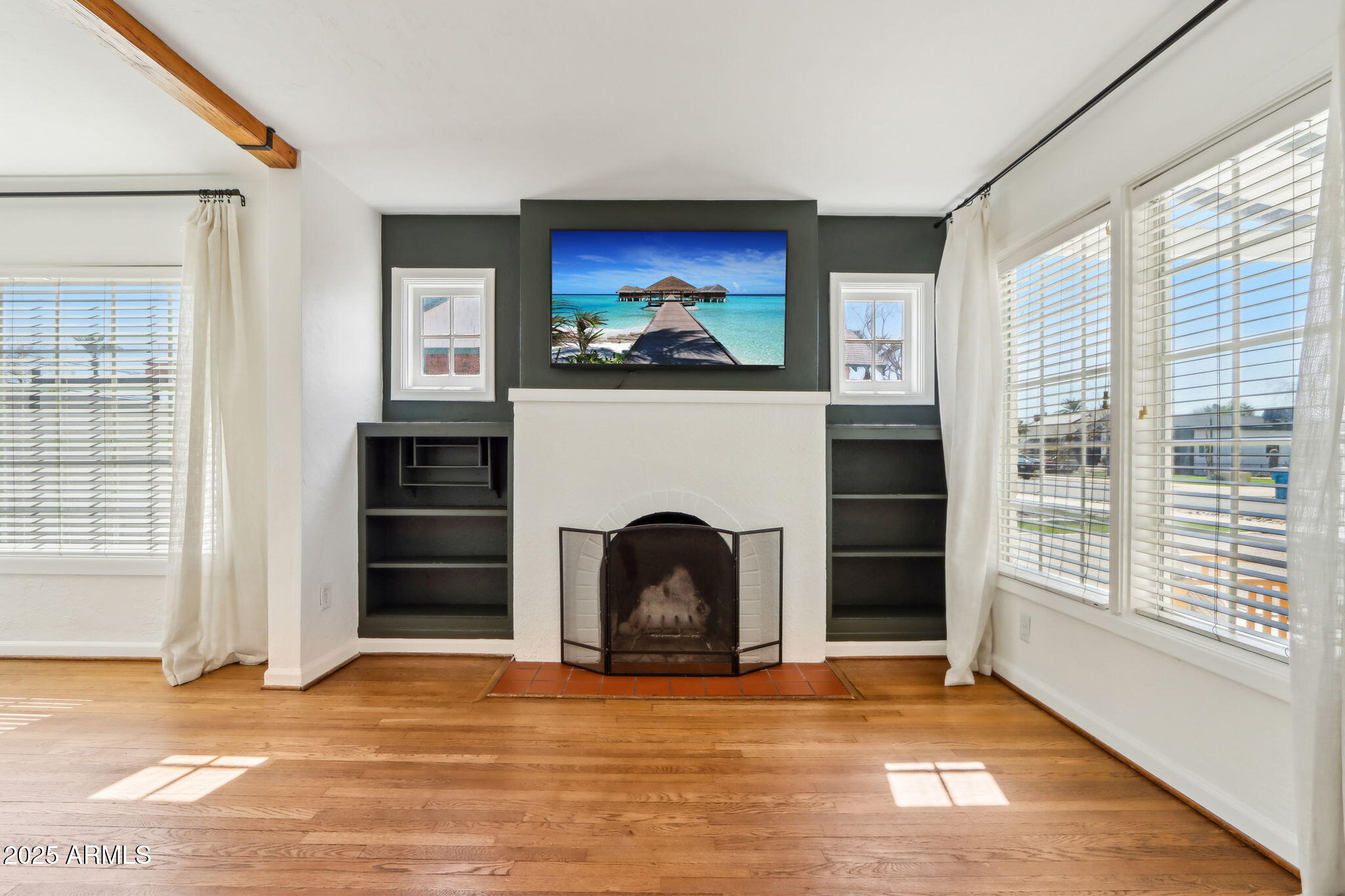 2237 North 9th Street Phoenix, AZ 85006 - Photo 3 of 29 a view of an empty room with a fireplace and a window