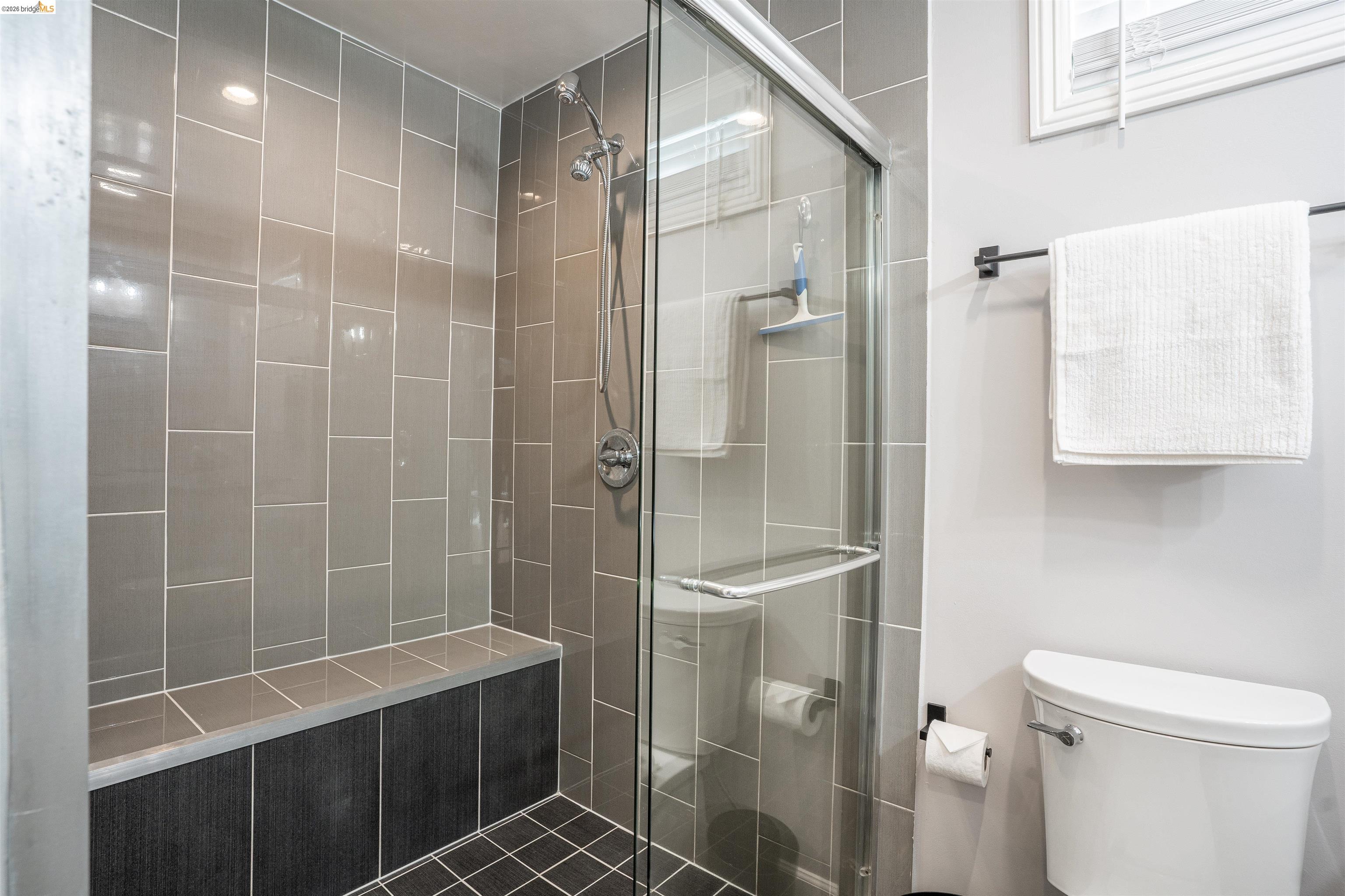 527 Chester Street Oakland, CA 94607 - Photo 19 of 47 525 (Downstairs) Bathroom featuring a double shower, bench and toilet