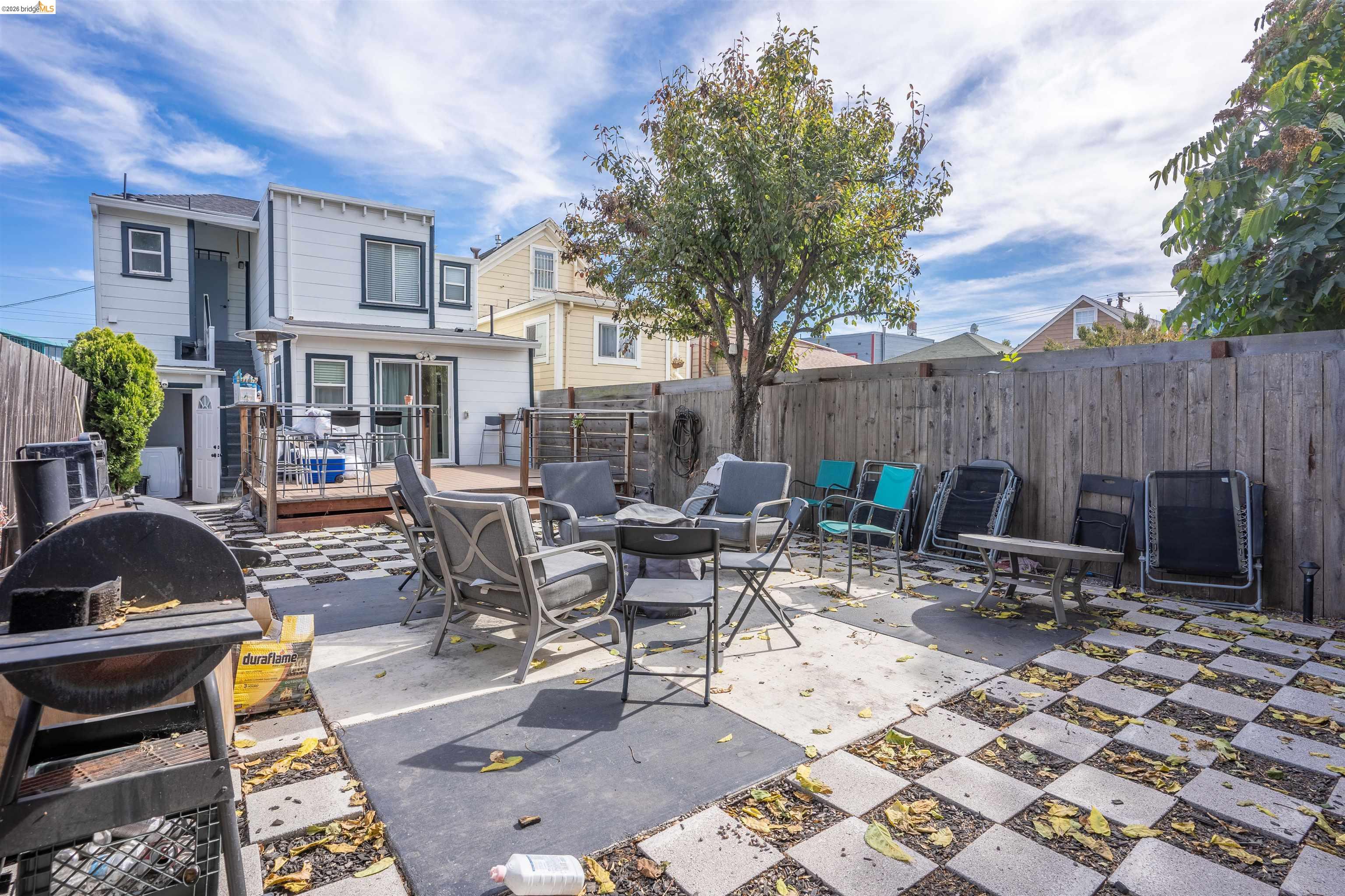 527 Chester Street Oakland, CA 94607 - Photo 23 of 47 Fenced backyard with a patio area, grilling area, a fire pit, and a deck