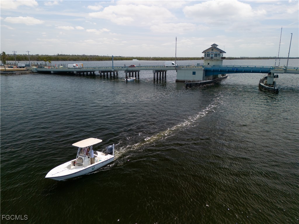 5500 Stringfellow Road St. James City, FL 33956 - Photo 20 of 22 a view of a lake with boats and trees