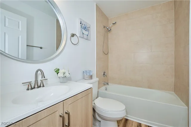 a bathroom with a sink a toilet and a bathtub