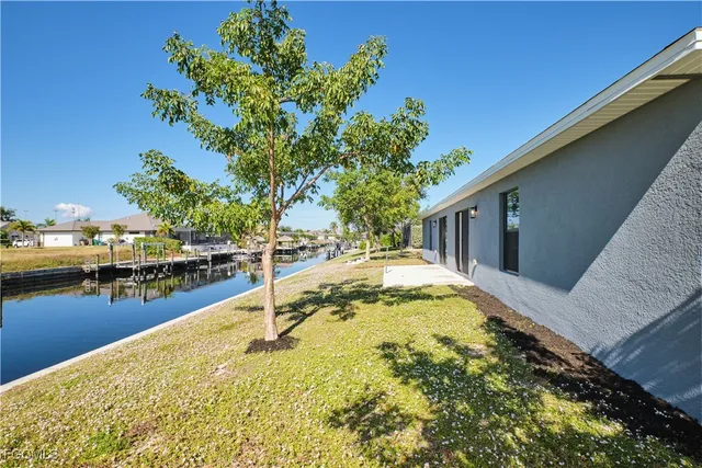a swimming pool with some trees in the background