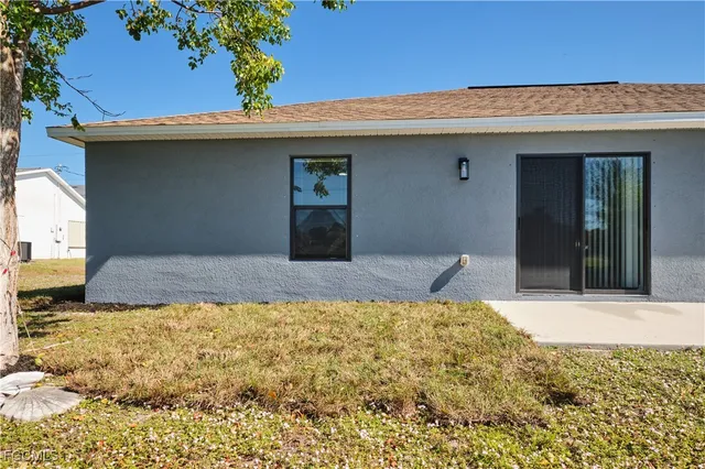 a view of backyard of a house