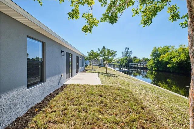 swimming pool view with a garden space