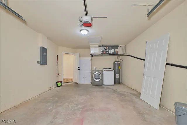a view of a storage & utility room with two washing machine