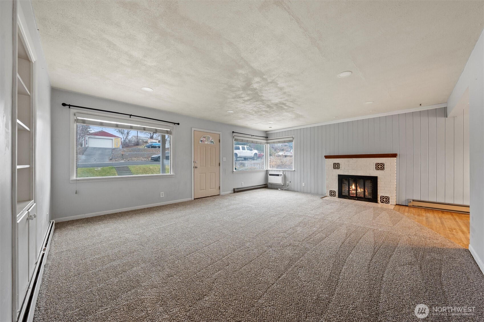 246 Maringo Road Ephrata, WA 98823 - Photo 7 of 40 a view of an empty room with a fireplace and a window
