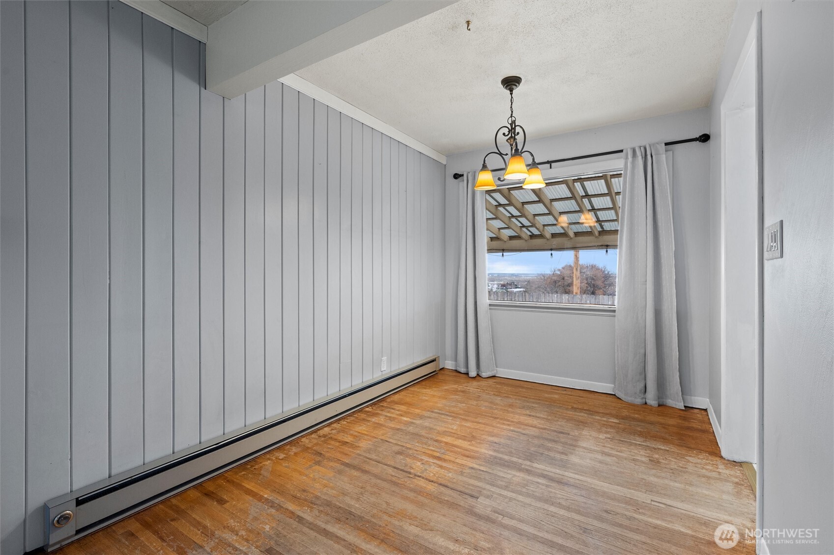 246 Maringo Road Ephrata, WA 98823 - Photo 10 of 40 a view of a room with wooden floor fan and windows