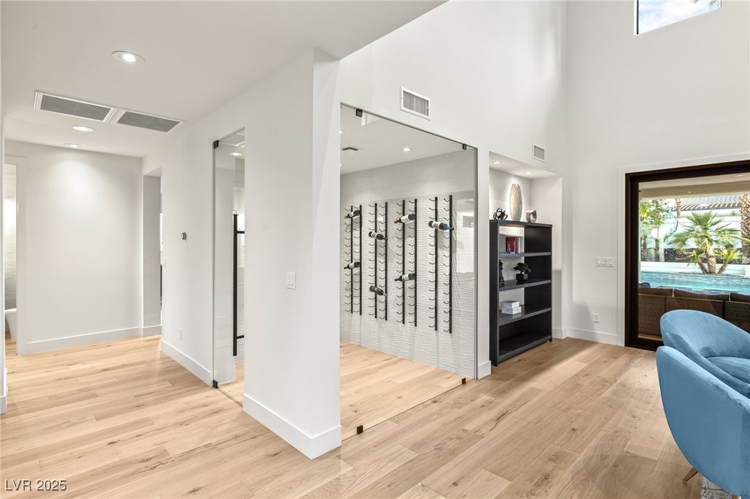 2316 Prometheus Court Henderson, NV 89074 - Photo 13 of 92 Corridor with visible vents, baseboards, and wood finished floors