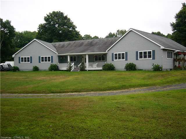 5 Wig Hill Road Chester, CT 06412 - Photo 1 of 1 a view of a house and a yard with a lot of windows