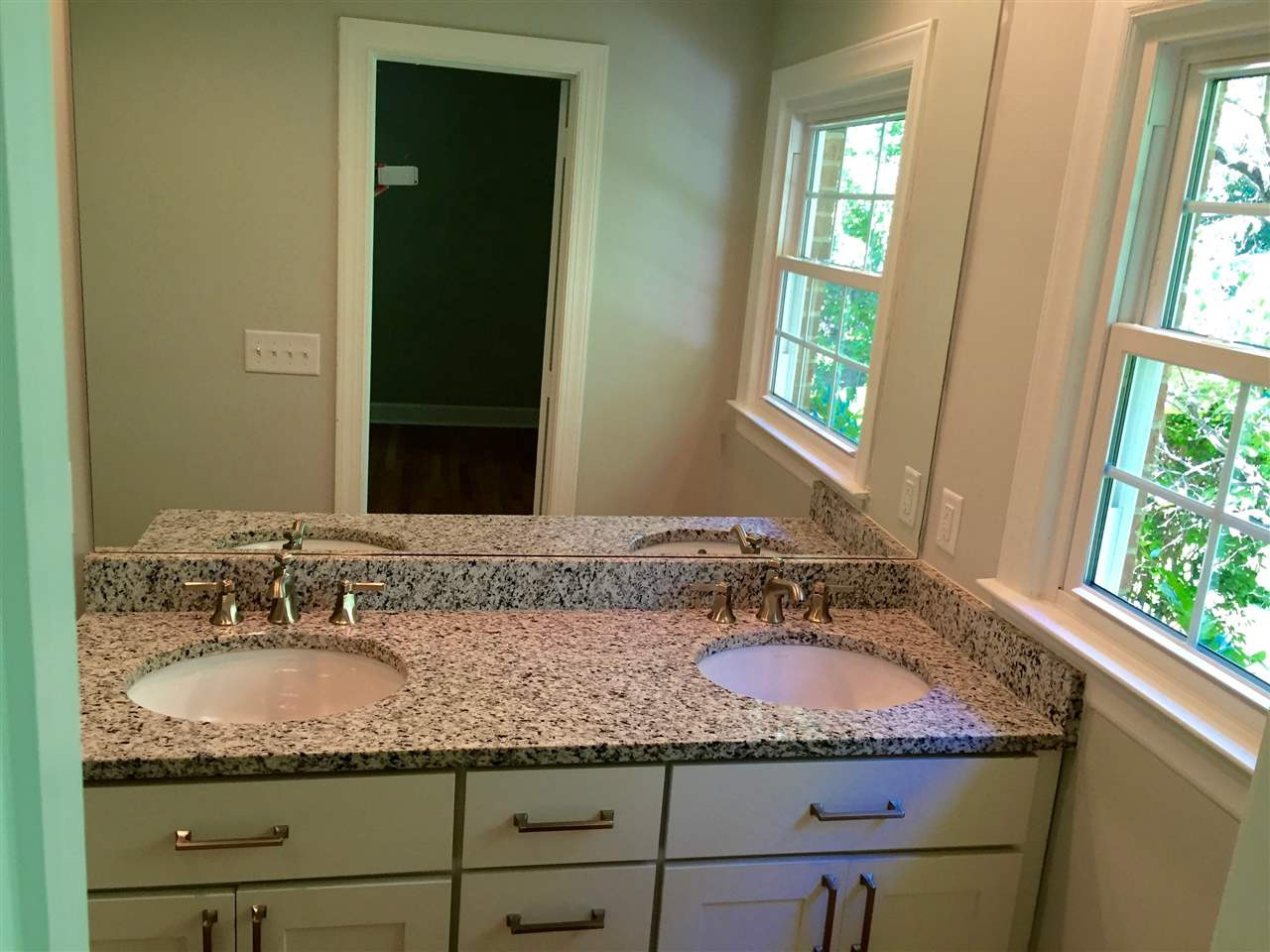 5721 Deblyn Avenue Raleigh, NC 27612 - Photo 8 of 12 The master vanity features double sinks and room for storage! This isn't your typical 60s ranch bathroom!! Master Bath/Spa