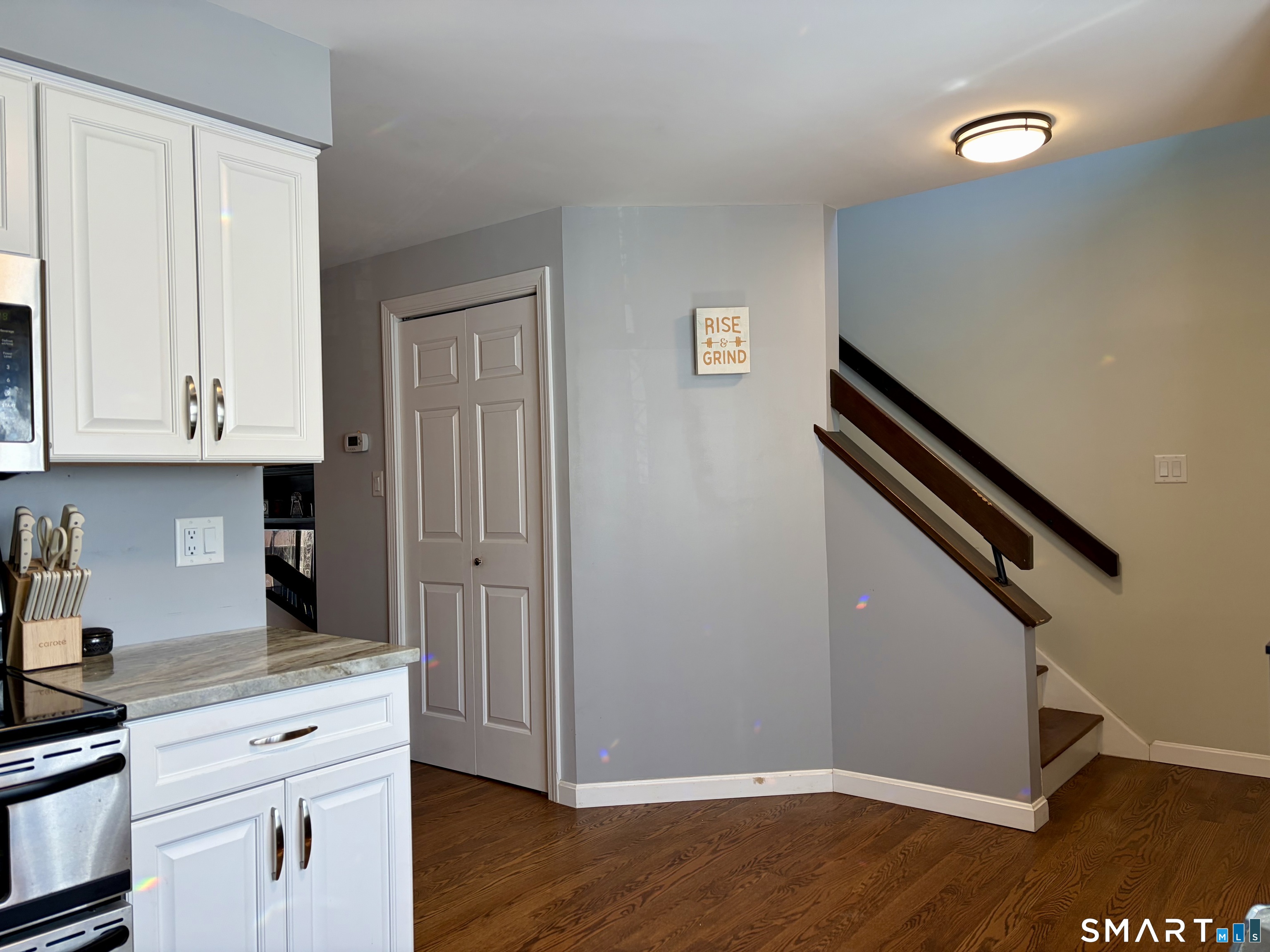 216 Natchaug Drive, Unit 216 Meriden, CT 06450 - Photo 11 of 40 a kitchen with granite countertop white cabinets and white appliances