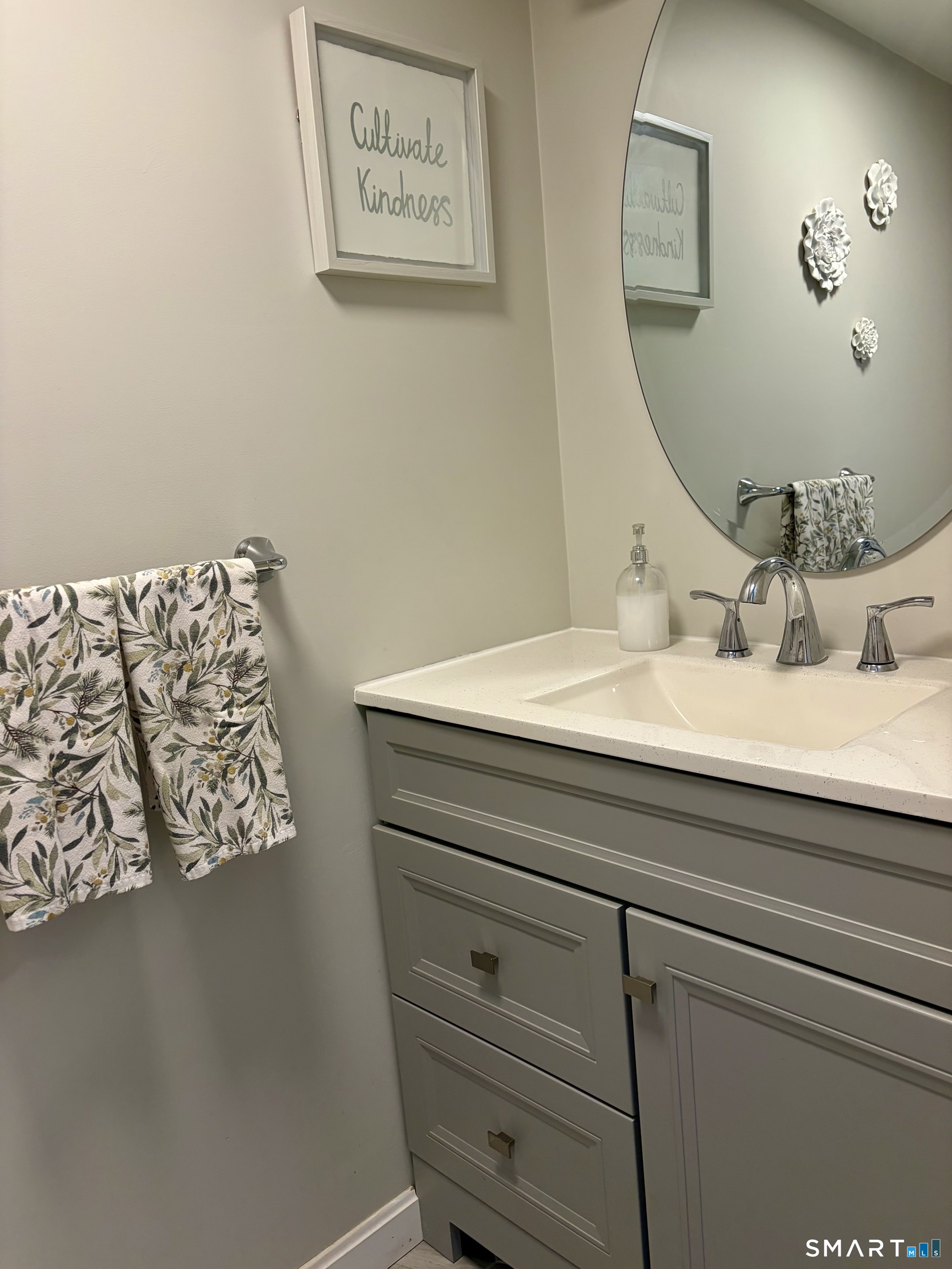 216 Natchaug Drive, Unit 216 Meriden, CT 06450 - Photo 12 of 40 a bathroom with a sink mirror and vanity