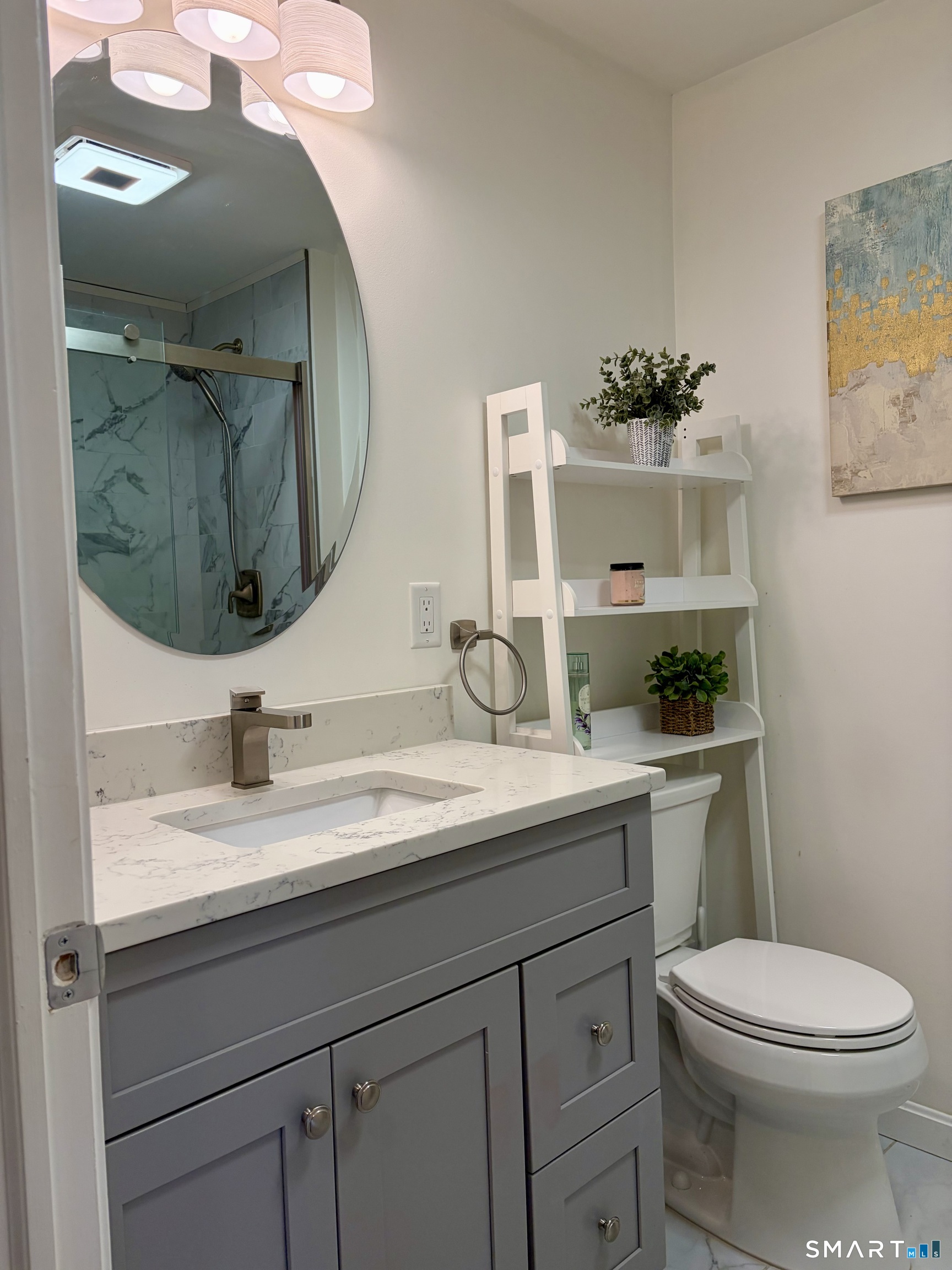 216 Natchaug Drive, Unit 216 Meriden, CT 06450 - Photo 15 of 40 a bathroom with a toilet sink and mirror