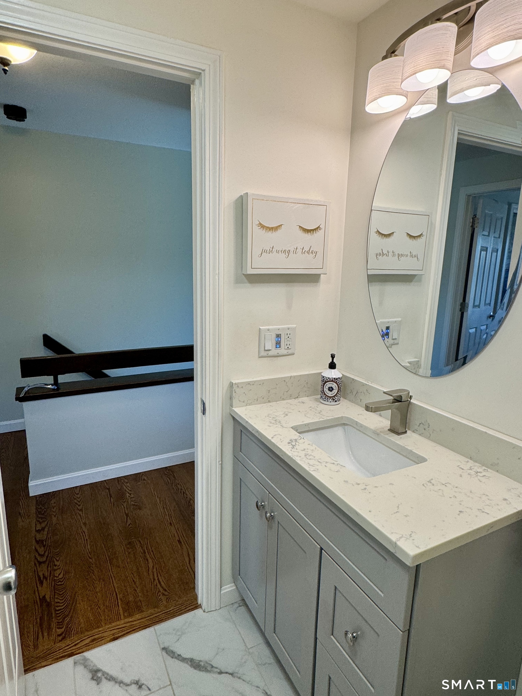 216 Natchaug Drive, Unit 216 Meriden, CT 06450 - Photo 16 of 40 a bathroom with a sink and a mirror
