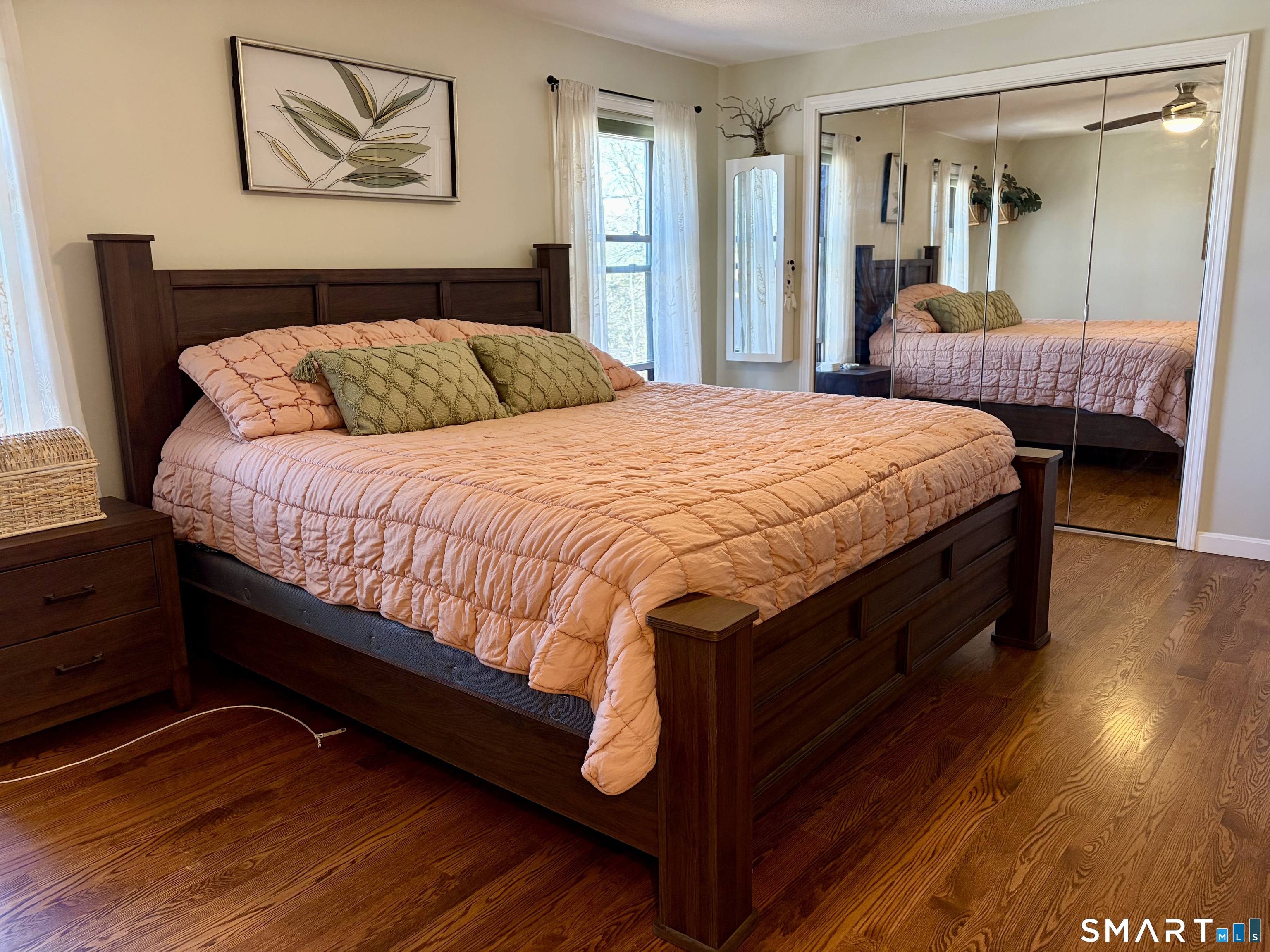 216 Natchaug Drive, Unit 216 Meriden, CT 06450 - Photo 19 of 40 a bedroom with a bed and a painting on the wall