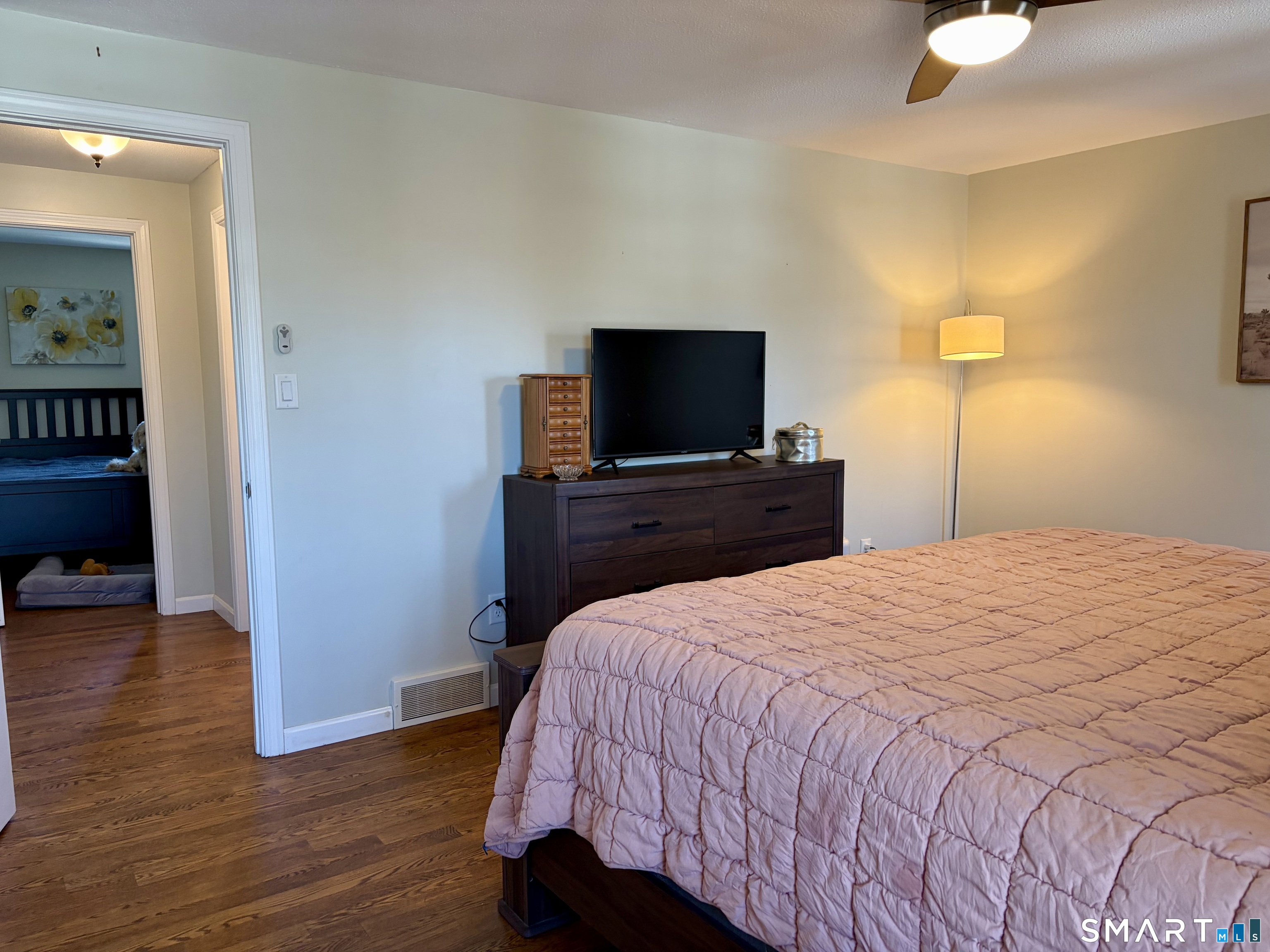 216 Natchaug Drive, Unit 216 Meriden, CT 06450 - Photo 22 of 40 a bedroom with a bed and a television