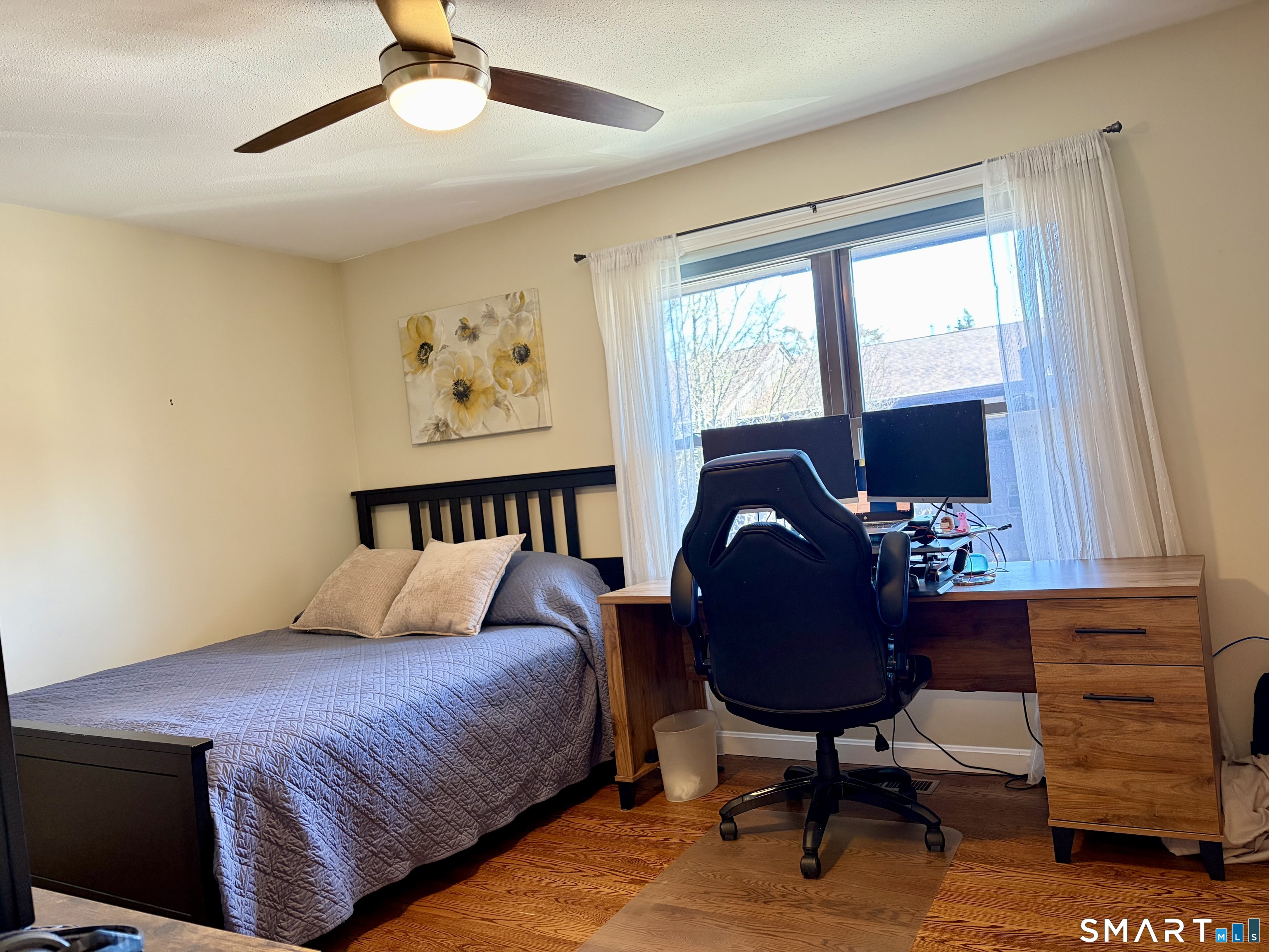 216 Natchaug Drive, Unit 216 Meriden, CT 06450 - Photo 23 of 40 a bed room with a bed and a chair