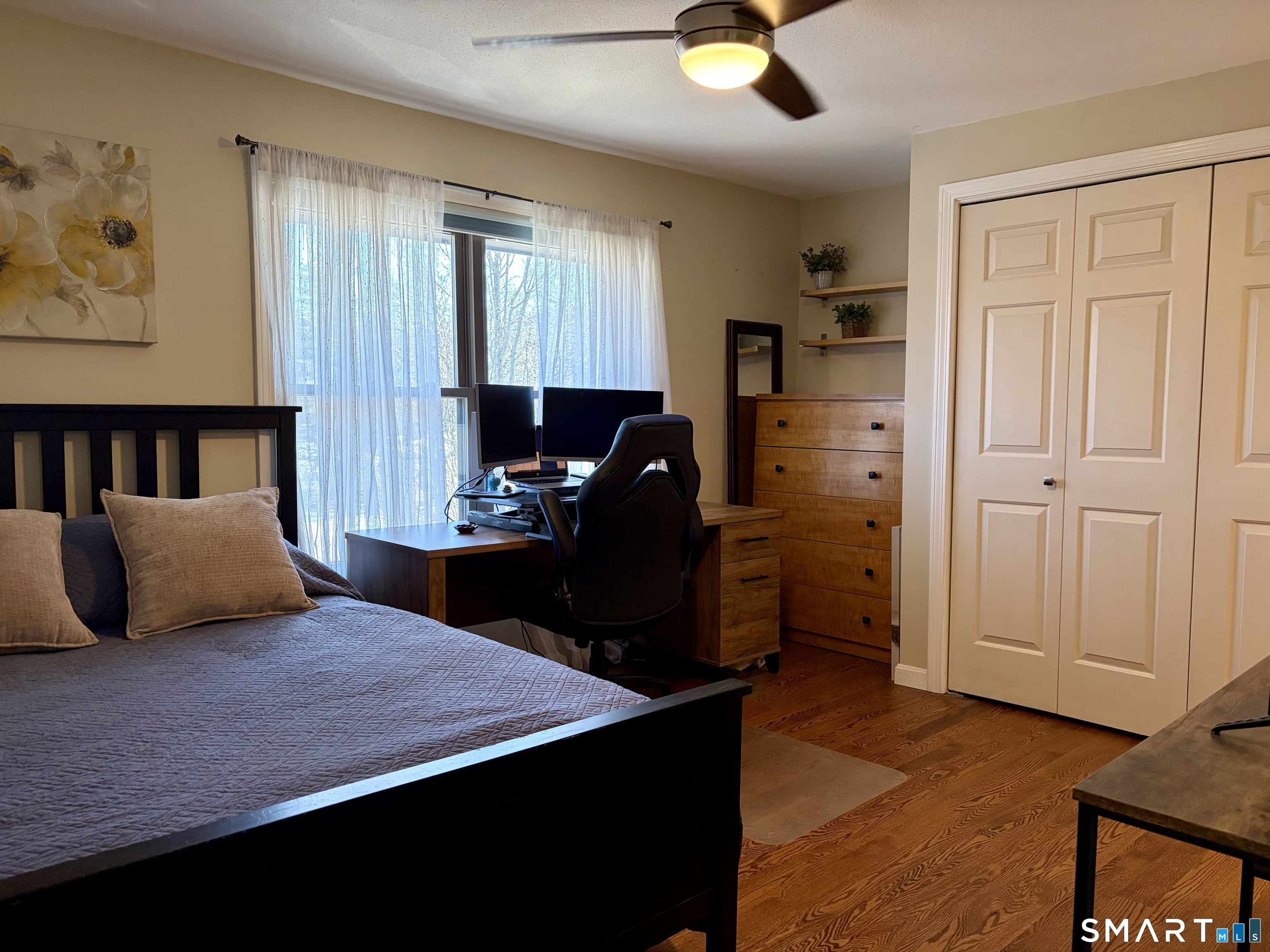 216 Natchaug Drive, Unit 216 Meriden, CT 06450 - Photo 24 of 40 a bedroom with a bed and cabinets