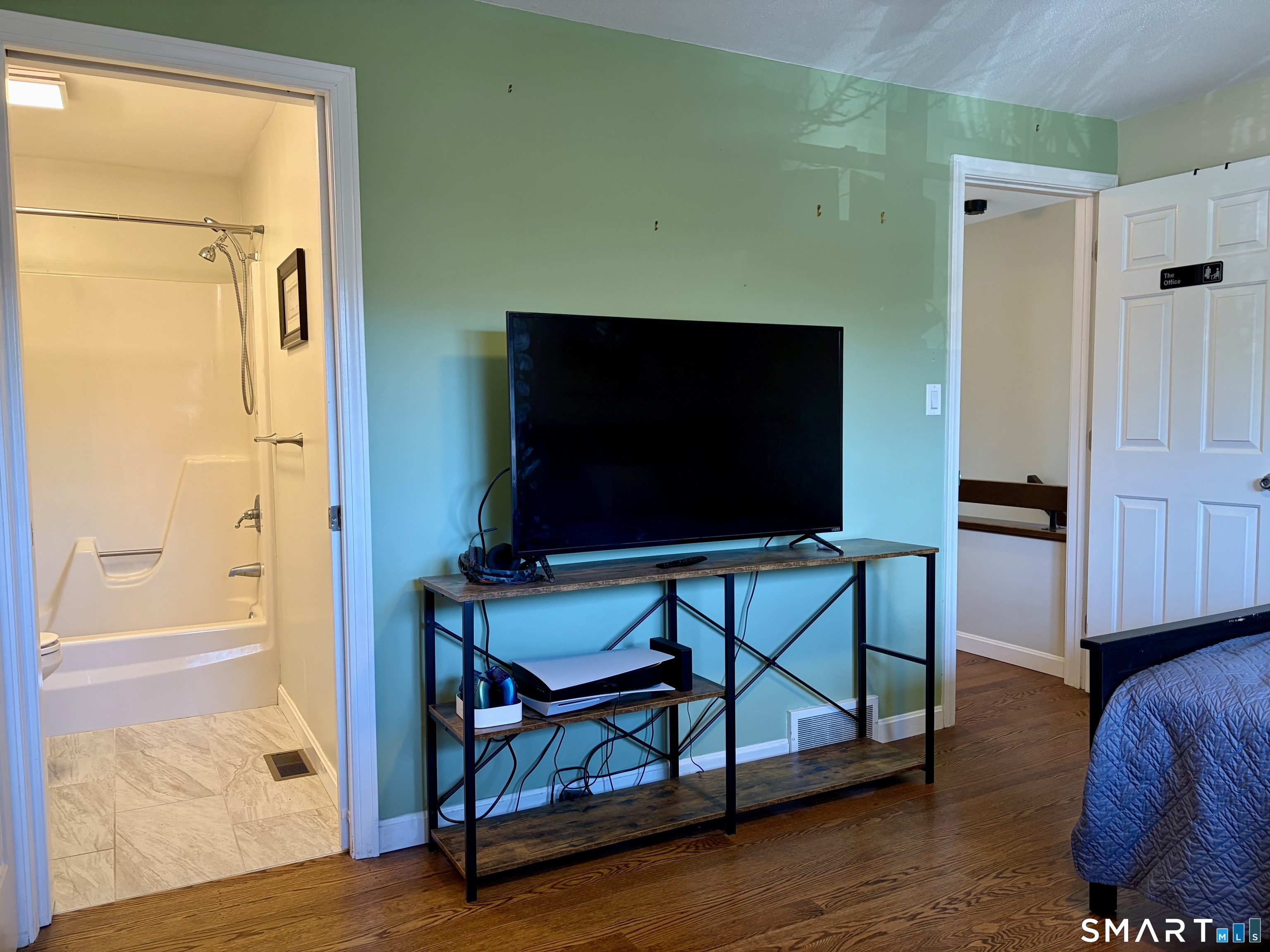 216 Natchaug Drive, Unit 216 Meriden, CT 06450 - Photo 26 of 40 a living room with furniture and a flat screen tv