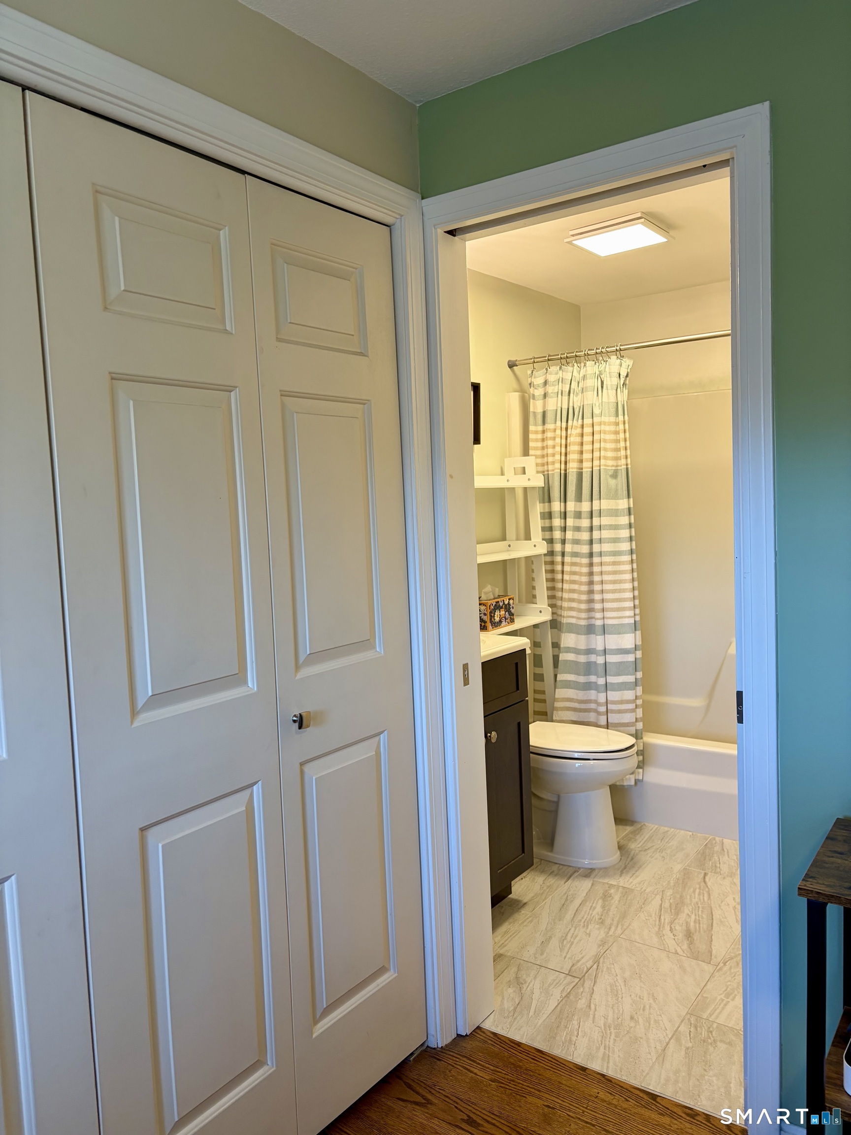 216 Natchaug Drive, Unit 216 Meriden, CT 06450 - Photo 27 of 40 a view of a bedroom with a hardwood floor